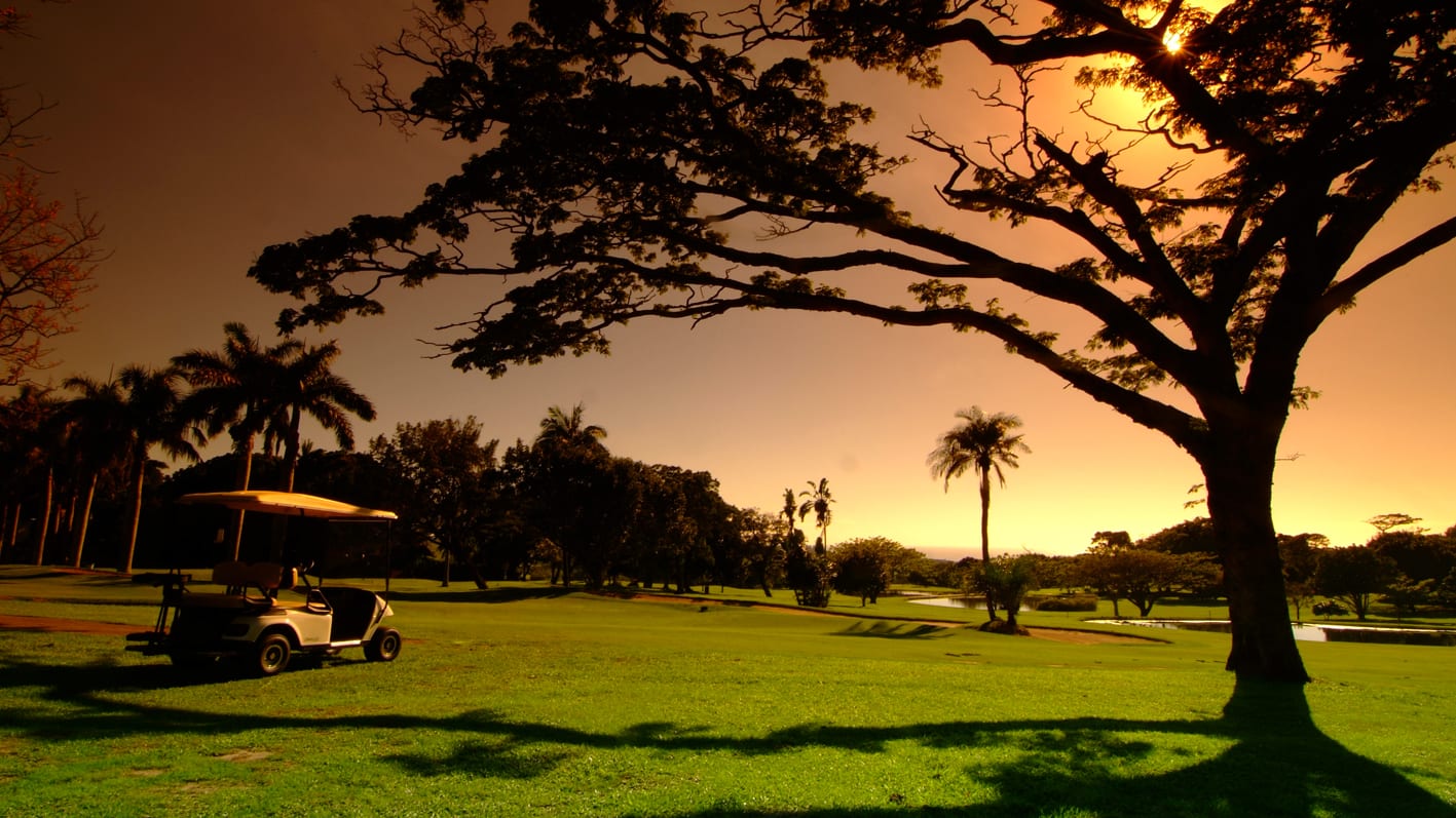 Scenic golf fairway winding through rolling African hills, premium South Africa golf tour and holiday packages